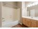 The bathroom has a tub, shower, vanity, and sink at 1506 W Laurel Ave, Gilbert, AZ 85233