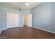 This bedroom has wood floors, closet and ceiling fan at 1506 W Laurel Ave, Gilbert, AZ 85233