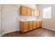 Mud room featuring built in storage cabinets, sink and direct access to exterior door at 1506 W Laurel Ave, Gilbert, AZ 85233