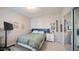 Bedroom featuring a large bed, an entertainment center, and a sliding door closet at 15252 N 100Th St # 1134, Scottsdale, AZ 85260