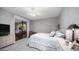 Well-lit bedroom with access to the patio, ceiling fan and neutral carpet at 15252 N 100Th St # 1134, Scottsdale, AZ 85260