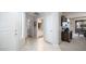 Bright hallway featuring tile flooring, white doors, and easy access to multiple rooms at 15252 N 100Th St # 1134, Scottsdale, AZ 85260