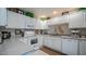 Well-maintained kitchen with white cabinetry, updated appliances, and decorative accents at 15252 N 100Th St # 1134, Scottsdale, AZ 85260