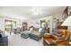 Cozy living room with comfortable seating, ceiling fan, and sliding glass doors to the outside at 15252 N 100Th St # 1134, Scottsdale, AZ 85260