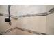 Close up of tiled shower featuring a shower head, shelf, and decorative accent tiles at 15252 N 100Th St # 1134, Scottsdale, AZ 85260