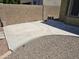 Concrete patio and low maintenance rock cover backyard with clear blue sky at 15352 W Ventura St, Surprise, AZ 85379