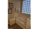 Bright bathroom featuring a soaking tub and decorative elements at 15352 W Ventura St, Surprise, AZ 85379