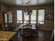 Elegant dining area with chandelier and natural light from large windows at 15352 W Ventura St, Surprise, AZ 85379