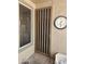 Secure front door with a decorative metal grill and adjacent window at 15352 W Ventura St, Surprise, AZ 85379