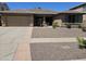 Inviting single-story home with a low-maintenance desert landscape and covered entry at 15352 W Ventura St, Surprise, AZ 85379