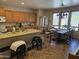 Open kitchen with an island and adjacent dining area with large windows at 15352 W Ventura St, Surprise, AZ 85379