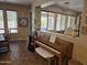Living area with dining area and piano, with great natural light at 15352 W Ventura St, Surprise, AZ 85379
