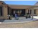 Covered patio with outdoor seating and built in grill at 15352 W Ventura St, Surprise, AZ 85379