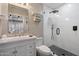 This modern bathroom features a frameless glass shower, stylish tiling, and vanity with sink at 16636 S 22Nd St, Phoenix, AZ 85048