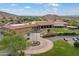 Beautiful clubhouse featuring lush landscaping, fountain and well-maintained grounds in a golf community at 16636 S 22Nd St, Phoenix, AZ 85048