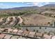 Panoramic aerial view of the community showcasing the homes, golf course, and mountain views at 16636 S 22Nd St, Phoenix, AZ 85048