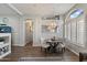 Elegant dining area with chandelier, plantation shutters, and seamless access to kitchen at 16636 S 22Nd St, Phoenix, AZ 85048