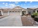 Charming home featuring neutral stucco, a three-car garage, and well-maintained landscaping at 16636 S 22Nd St, Phoenix, AZ 85048