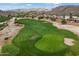 Scenic view of the lush green golf course with sand traps, palm trees and desert landscaping at 16636 S 22Nd St, Phoenix, AZ 85048