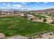 An aerial view of the meticulously designed golf course, with lush fairways, sand traps and mountain views at 16636 S 22Nd St, Phoenix, AZ 85048
