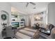 Cozy open-concept living room, adjacent to kitchen and dining area, featuring a ceiling fan at 16636 S 22Nd St, Phoenix, AZ 85048