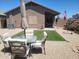 Inviting backyard featuring patio furniture and a neatly turfed area, perfect for relaxing and entertaining at 1769 E Jacob St, San Tan Valley, AZ 85140