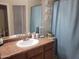Bathroom featuring a single sink vanity and blue accents at 1769 E Jacob St, San Tan Valley, AZ 85140