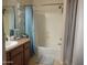 Bathroom with a shower and a white tub at 1769 E Jacob St, San Tan Valley, AZ 85140