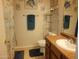 Bathroom with a vanity, toilet, and shower with decorative accents at 1769 E Jacob St, San Tan Valley, AZ 85140