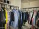 Organized walk-in closet with ample clothing storage at 1769 E Jacob St, San Tan Valley, AZ 85140