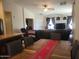 Dining area with a table and chairs flowing into the living room and kitchen at 1769 E Jacob St, San Tan Valley, AZ 85140