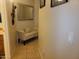 Hallway featuring decorative mirror and artwork, bench with throw pillow at 1769 E Jacob St, San Tan Valley, AZ 85140