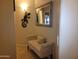Hallway featuring decorative mirror and artwork, bench with throw pillow at 1769 E Jacob St, San Tan Valley, AZ 85140