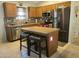 Kitchen with stainless steel appliances, kitchen island, and granite counters at 1769 E Jacob St, San Tan Valley, AZ 85140