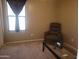 Living room featuring an armchair and a glass-top coffee table at 1769 E Jacob St, San Tan Valley, AZ 85140