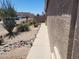 Landscaped side yard featuring decorative rock, desert plants and solar lighting for evening ambiance at 1769 E Jacob St, San Tan Valley, AZ 85140