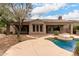 Stunning backyard with a private pool, patio, and well-manicured landscaping at 18359 W Sweet Acacia Dr, Goodyear, AZ 85338