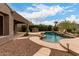 Enjoy a backyard paradise with a private pool, built-in BBQ, and lush landscaping at 18359 W Sweet Acacia Dr, Goodyear, AZ 85338