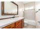 Bathroom features a vanity, sink, and shower with tub at 18359 W Sweet Acacia Dr, Goodyear, AZ 85338