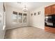 Dining area with designer lighting fixture and views of the backyard at 18359 W Sweet Acacia Dr, Goodyear, AZ 85338
