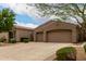 Attractive home exterior featuring desert landscaping and a spacious driveway at 18359 W Sweet Acacia Dr, Goodyear, AZ 85338