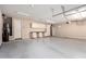 Spacious garage with built-in cabinets and room for multiple vehicles at 18359 W Sweet Acacia Dr, Goodyear, AZ 85338