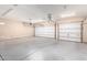 Spacious garage featuring two garage doors and ample room at 18359 W Sweet Acacia Dr, Goodyear, AZ 85338