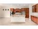 Spacious kitchen featuring a large island and ample cabinet space at 18359 W Sweet Acacia Dr, Goodyear, AZ 85338