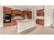 Open kitchen featuring a center island, granite countertops, tile backsplash and rich wood cabinetry at 18359 W Sweet Acacia Dr, Goodyear, AZ 85338