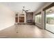 Bright living room features fireplace, recessed lighting and neutral tile floors at 18359 W Sweet Acacia Dr, Goodyear, AZ 85338