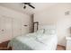 Bedroom featuring a sliding door closet, a comfy bed, and an open floor plan at 18415 W Capistrano Ave, Goodyear, AZ 85338