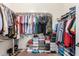 Walk-in closet with ample shelving and hanging space for organizing clothes and shoes at 18415 W Capistrano Ave, Goodyear, AZ 85338