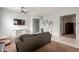 Comfortable living room with tile flooring, a ceiling fan, and a neutral color palette at 18415 W Capistrano Ave, Goodyear, AZ 85338