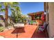 Outdoor paradise showcasing a bar, hammock, vibrant plants, and a relaxing, inviting atmosphere at 18662 W Foothill Dr, Surprise, AZ 85387